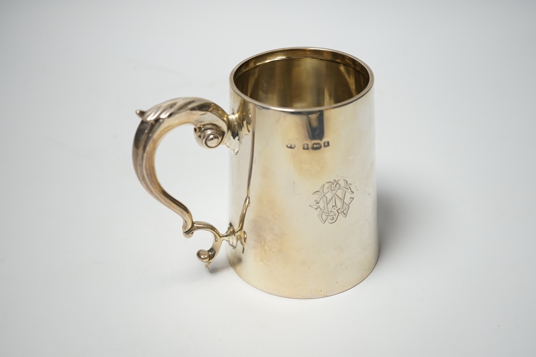 An Edwardian silver mug, of tapering form, William Aitken, Birmingham, 1906, 11.4cm, 12.8oz.
